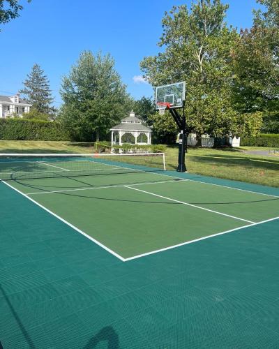 a tennis court with a net on top of it at Antrim 1844 in Taneytown