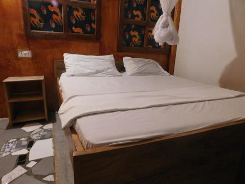 Postel nebo postele na pokoji v ubytování Paje lounge