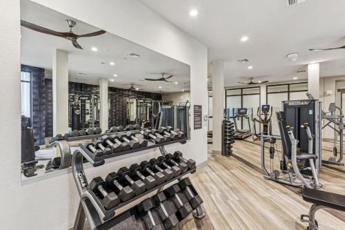 a gym with several treadmills and weights at Boulevard Stays Modern Roosevelt Row Suite 1BR Pool Gym 3 in Phoenix