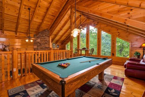 a pool table in a room in a cabin at One More Night in Waldens Creek