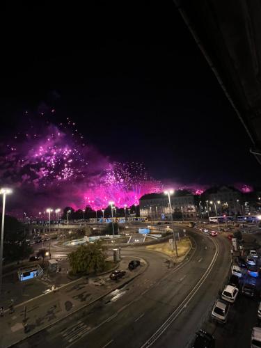 a night view of a city with pink fireworks at Rustic Gallery Apartment with Panoramic View and AC in Budapest