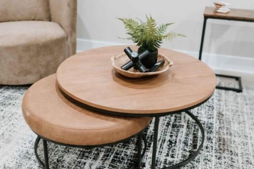 a wooden table with a plant in a bowl on it at 2 Beds, Built-in Office, Gated Entry in Council Bluffs