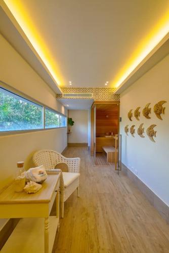 a living room with a table and a dining room at Aquarella Caribbean Blue Summer Special GateAway in La Puntica de Juan Dolio
