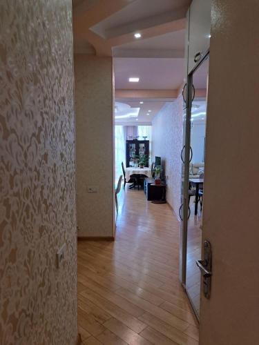 an open door to a hallway with a dining room at სასიამოვნო ბინა საბურთალოზე in Tbilisi City