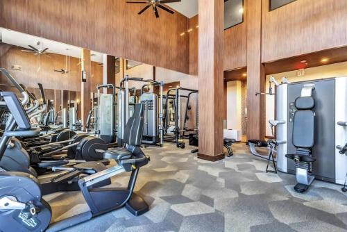a fitness room with treadmills and cardio machines at Boulevard Stays Dashing King Studio Suite Pool Parking Gym M in Richardson