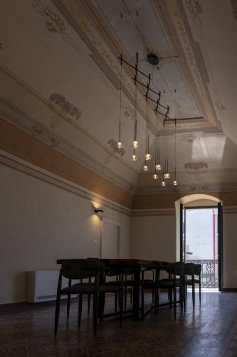 a dining room with a table and chairs at Casale della Vittoria in Taranto