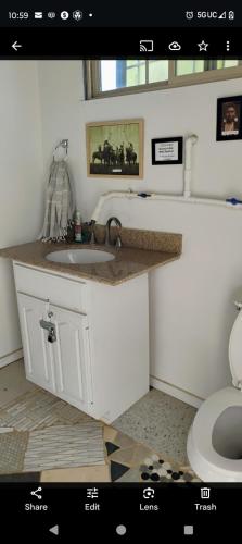 a bathroom with a sink and a toilet at The Dome at Tribal Camp in Joshua Tree