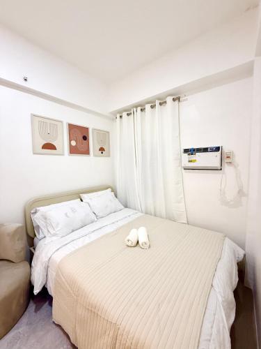 Postel nebo postele na pokoji v ubytování Near Mactan Airpor Hideout Condo