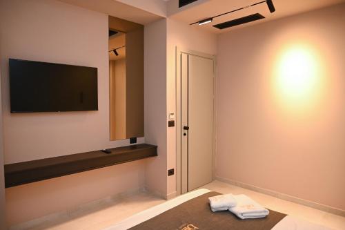 a room with a flat screen tv on the wall at Bliss Luxury Villa in Rrushkull