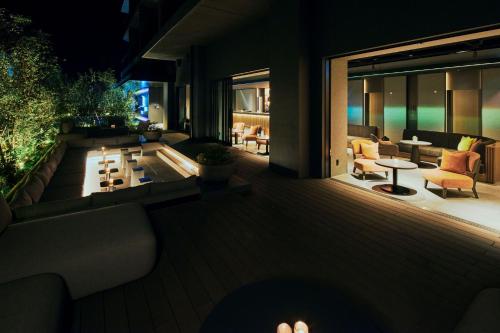 a house with a deck with a pool and furniture at edit x seven FUJI GOTEMBA in Gotemba