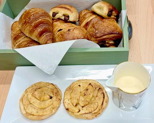 a box of pastries and cookies on a table at Kings' House in Douglas