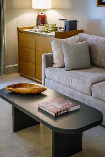 a living room with a couch and a table at Casa Lucia Member of Melia Collection in Buenos Aires