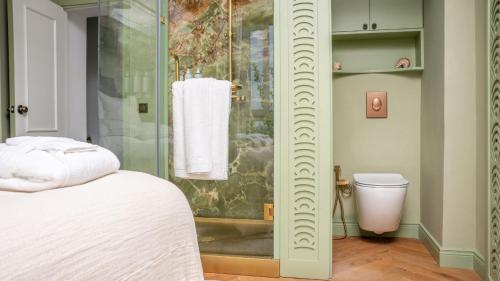 a bathroom with a shower and a toilet in it at Riad Dar Baraka Rabat in Rabat