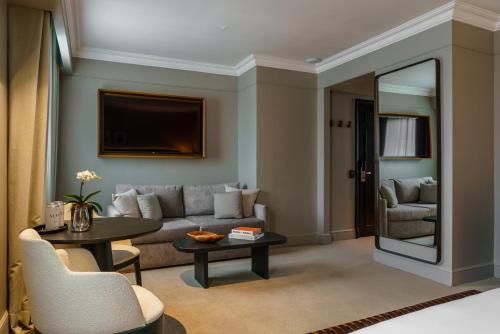 a living room with a couch and a table at Casa Lucia Member of Melia Collection in Buenos Aires