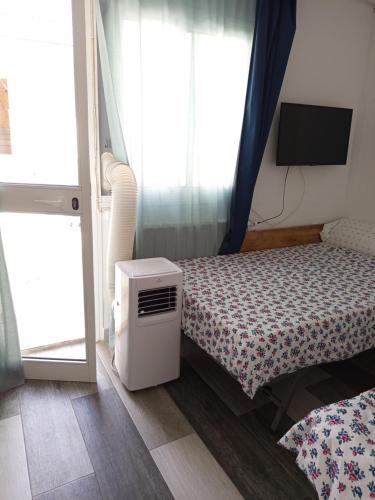 Letto o letti in una camera di La Casa del Patio ATQ