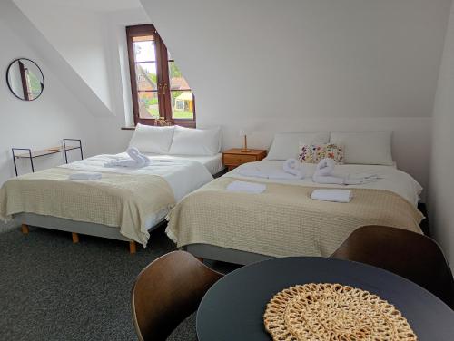 Postel nebo postele na pokoji v ubytování Apartamenty PORT&VELO
