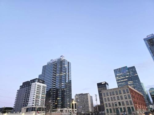 a group of tall buildings in a city at Mordern 2BedRoom Downtown Apt with Free Parking & Wifi in Edmonton