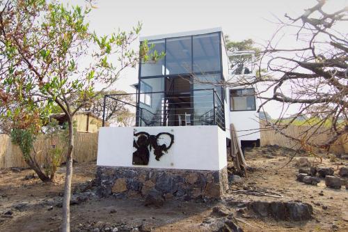 a house with a painting on the side of it at Piedra Cobre Panoramic in Tepoztlán