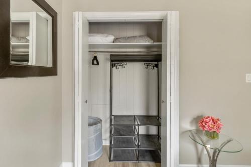 a walk in closet with a mirror and a shelf at Pet Friendly Near Anna Maria And Img in Bradenton