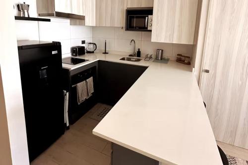 Cucina o angolo cottura di Departamento estudio con terraza vista al mar