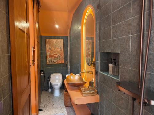 a bathroom with a sink and a toilet at Güzel Villa Bali in Badung
