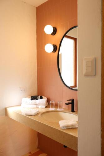 a bathroom with a sink and a mirror at La Posada del Puente in Arequipa