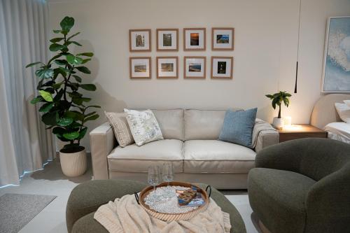 a living room with a couch and two chairs at Seaside Cove Studio-Completely Renovated! in Fajardo