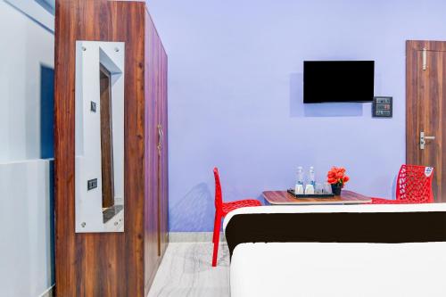 Hotel O Ritushreeにあるテレビまたはエンターテインメントセンター