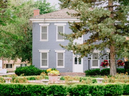 a blue house with flowers in front of it at Homestead Resort in Midway
