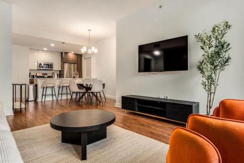 a living room with a couch and a table at Boulevard Stays 5 mins to Riverwalk & Mag Mile 03 in Chicago