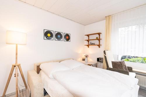 Postel nebo postele na pokoji v ubytování Hanseat II Whg 101