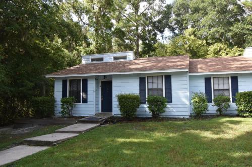 a white house with a brown roof at 306 Adm Wlk in Saint Marys