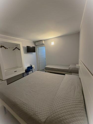Llit o llits en una habitació de Residence Regina