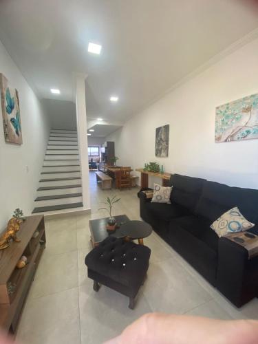 Χώρος καθιστικού στο Quarto com Varanda e Vista para a Mata