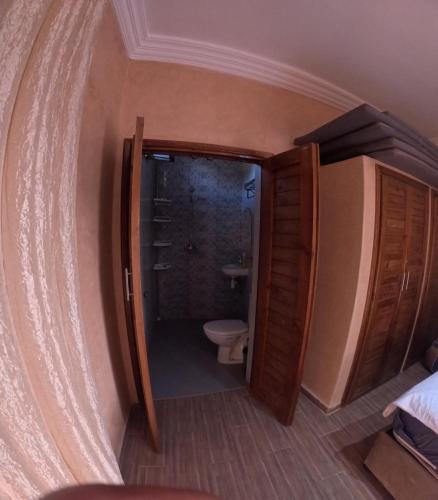 a bathroom with a shower and a toilet in a room at our home in Ghazoua