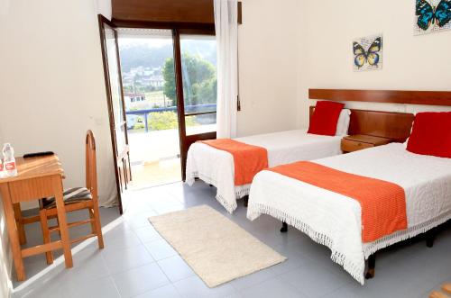 Katil atau katil-katil dalam bilik di Residencial Braga