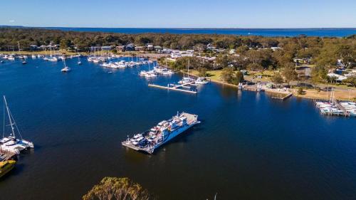 an aerial view of a marina with boats in the water at Kambera House in Raymond Island