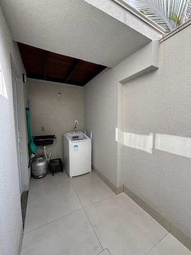 a room with a small refrigerator in a room at Mini Loft Siena in Sinop