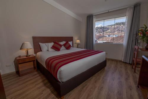 Postel nebo postele na pokoji v ubytování Quechua Plaza Hotel
