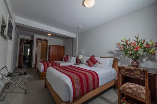 Postel nebo postele na pokoji v ubytování Quechua Plaza Hotel