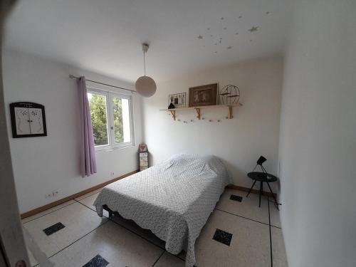 Postel nebo postele na pokoji v ubytování Maison avec jardin