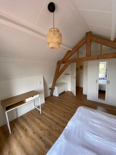 Ένα ή περισσότερα κρεβάτια σε δωμάτιο στο Strandhuis 77