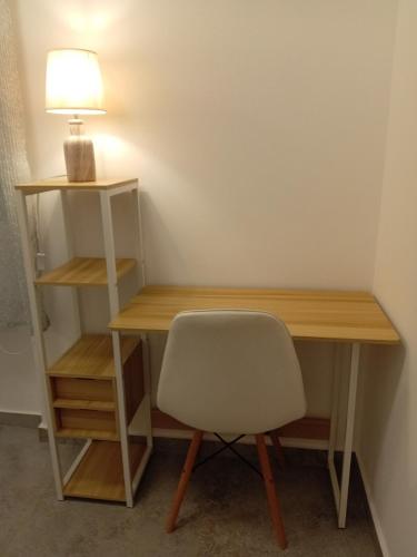 a desk with a chair and a lamp at Sea & Olive Retreat in Zipárion