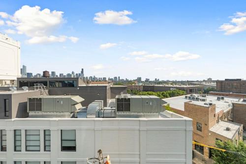 a view of the city from the roof of a building at 2BR City Escape Bright Sleek Spacious in Chicago