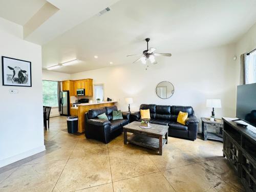 a living room with a couch and a table at Chateau 8 in Hammond