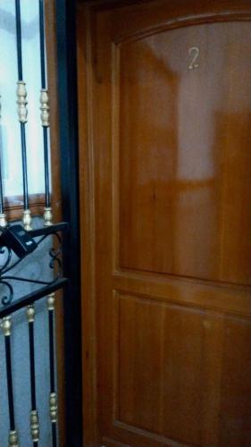a wooden door with the number on it next to a window at M'Diq Minute Walk-1st Floor in M'diq