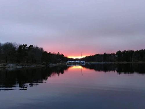 a view of a river at sunset at 4 person holiday home in INGARÖ-By Traum in Grönskan