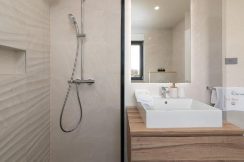 a bathroom with a shower and a sink at Villa Perla in Poreč