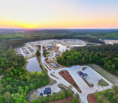 an aerial view of a parking lot with a parking lot at Savannah Lakes RV Resort in Hardeeville