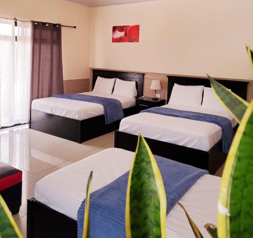 Postel nebo postele na pokoji v ubytování Diesbu Hotel